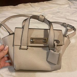 Cream leather Henri Bendel. Adjustable strap for crossbody style or clutch